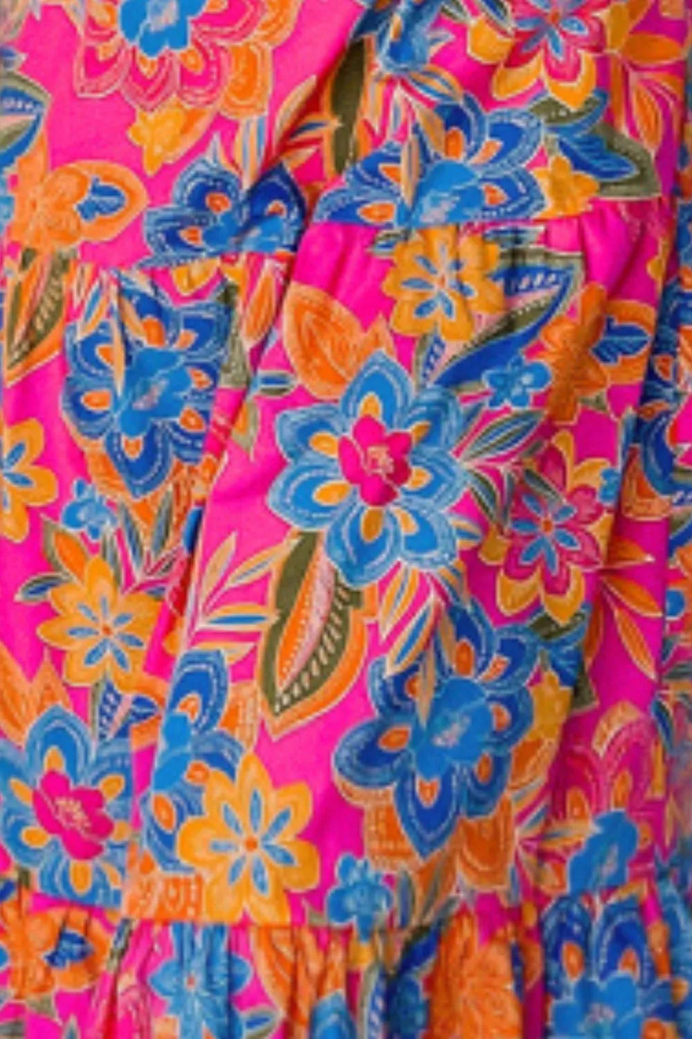 Printed V-Neck Cap Sleeve Pocketed Midi Dress featuring a colorful floral pattern on a pink background.