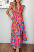 Printed V-Neck Cap Sleeve Pocketed Midi Dress worn by a model, featuring vibrant floral patterns and pockets.