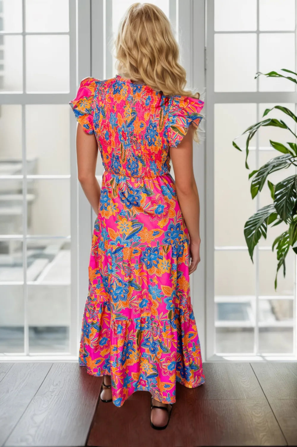 Printed V-Neck Cap Sleeve Pocketed Midi Dress featuring a colorful floral pattern and ruffled sleeves.